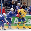 MINSK, BELARUS - MAY 15: Sweden's Dick Axelsson #28 pulls the puck away from France's Teddy Da Costa #80 during preliminary round action at the 2014 IIHF Ice Hockey World Championship. (Photo by Richard Wolowicz/HHOF-IIHF Images)